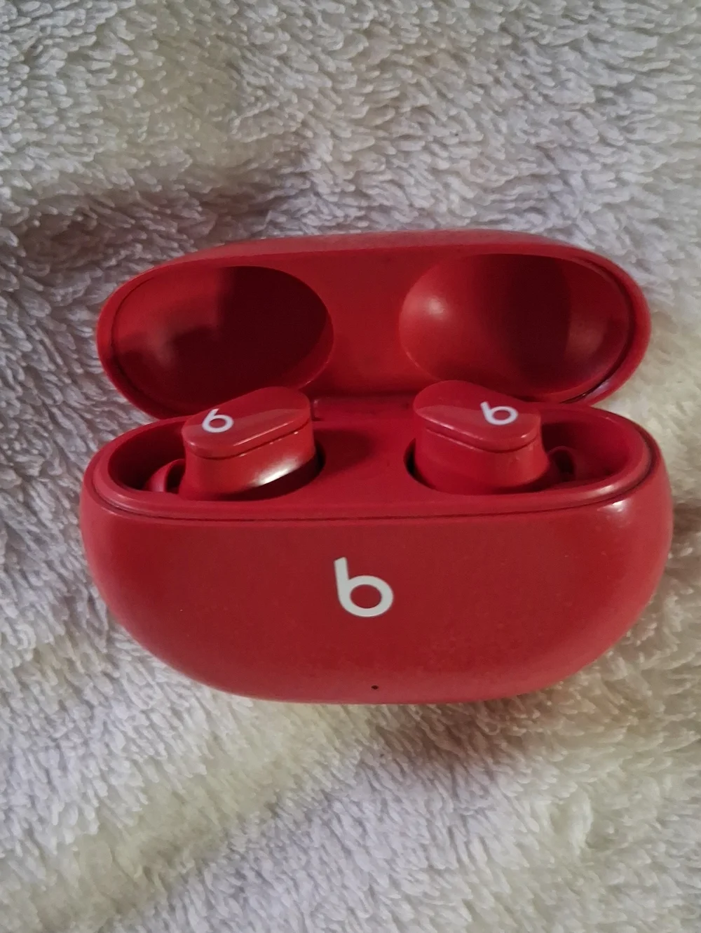 Beats wireless Ear Buds And Red Wireless Earbuds Charging Case
